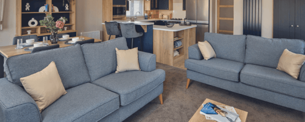 Holiday Lodge Ownership - Modern open-plan interior of the Willerby New Holland lodge at Saxon Park Lodges, featuring a stylish lounge, dining area, and fully equipped kitchen